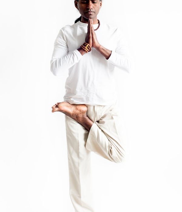 A focused man meditating after a workout session, showing mental clarity.